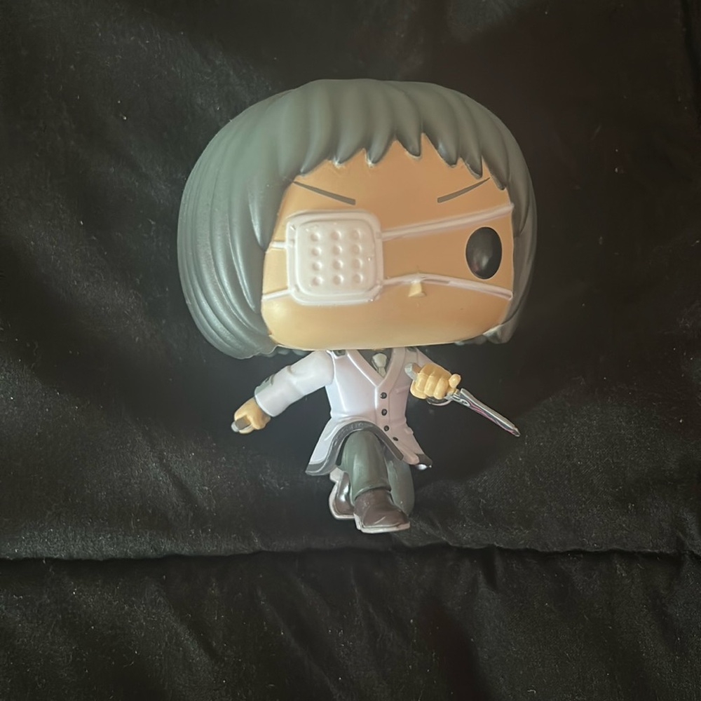 Funko Pop Figure with Gray Hair and White Outfit